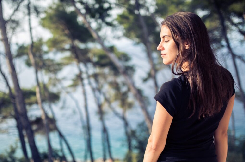 woman relaxing outside in nature