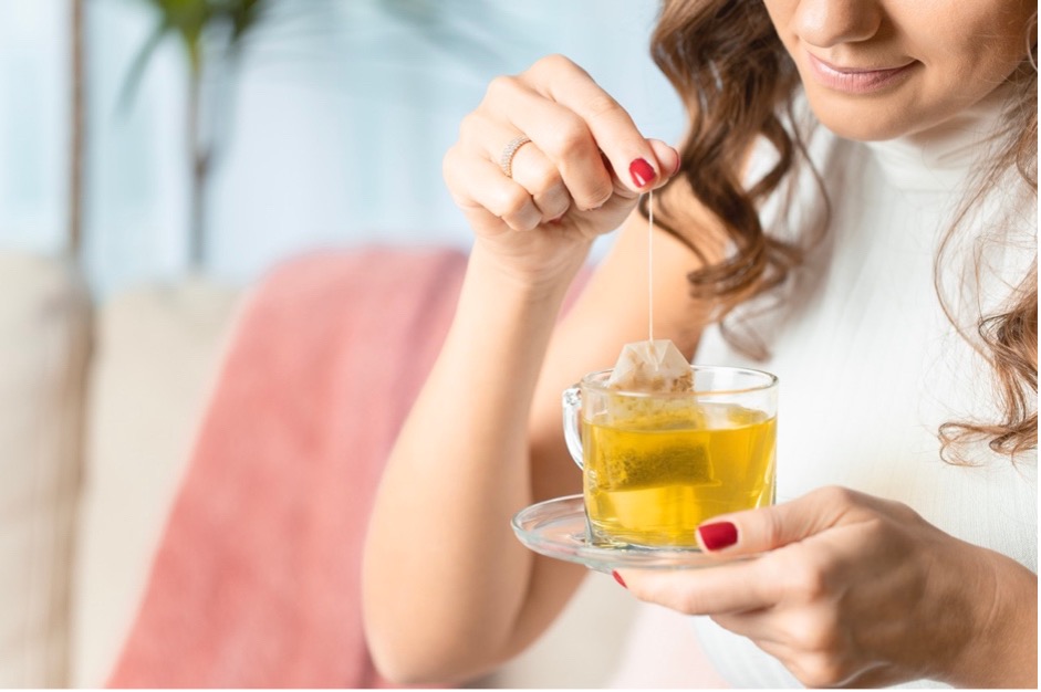 Woman drinking herbal tea.