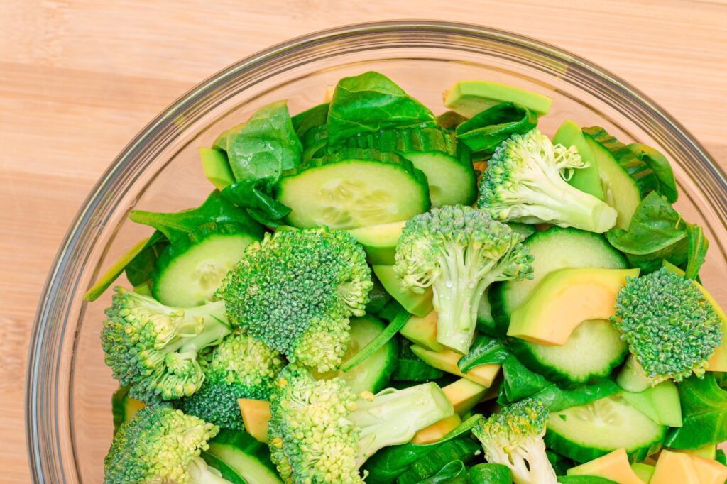 Fresh Green Salad of Avocado, Broccoli, Spinach and Cucumber for Body Detoxification. Vegan Salad. Vegetarian Culture. Raw Food. Healthy Eating and Vegetable Diet