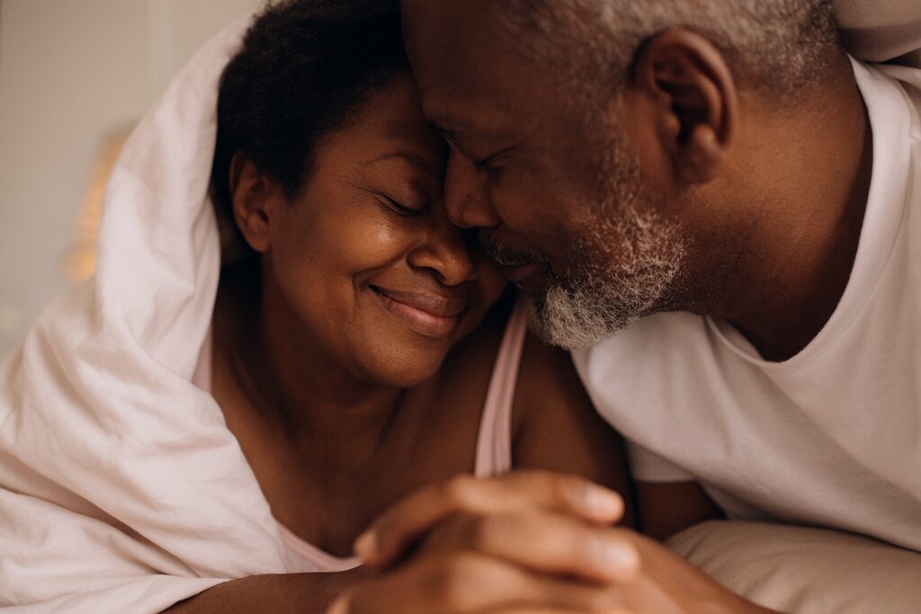 A couple cuddling together.